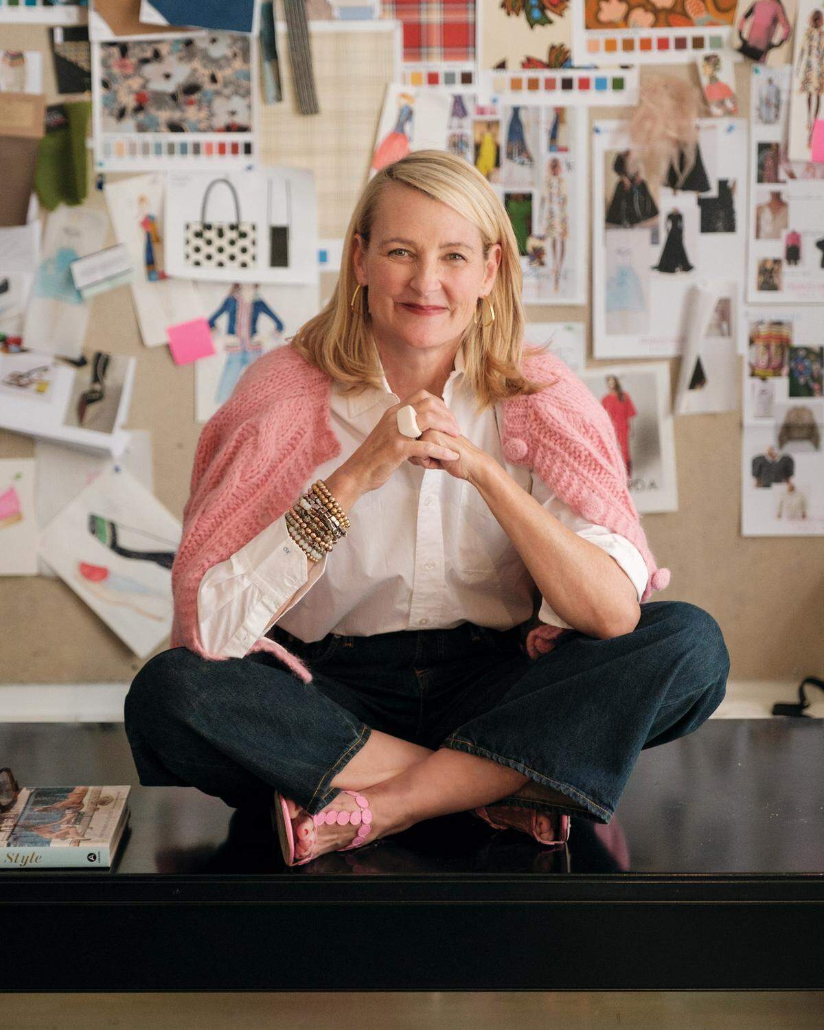 Elyce Arons, co-founder of the brands Kate Spade and Frances Valentine, surrounded by designs.