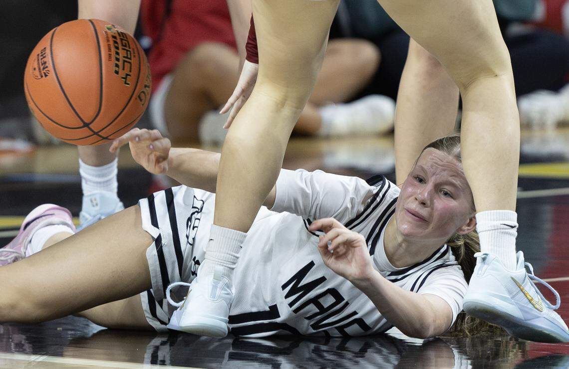 Maize South’s Blakely Lowe looks for a teammate to pass to after scrambling for a loose ball against St. James Academy on Wednesday night during the 5A girls quarterfinal game at Koch Arena.