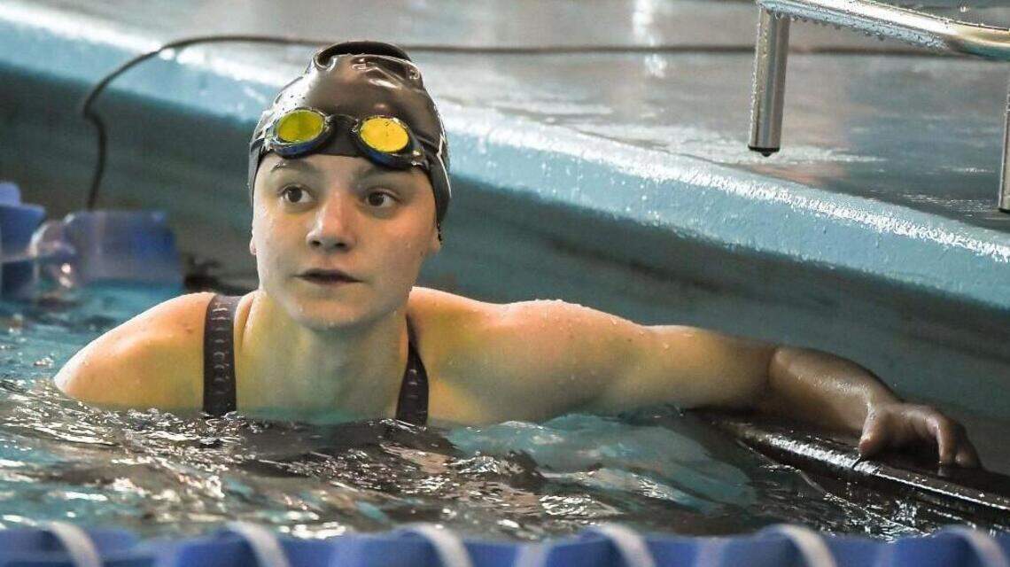 She could be a state champion in swim and track at the same time