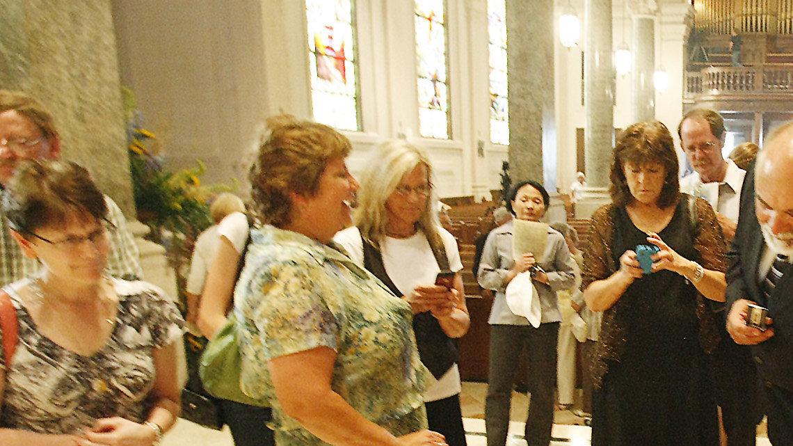 Gail Makovec touches the box with over 8,200 documents about Father Emil Kapaun for good luck following a Mass and closing ceremony for the beatification and canonization of Kapaun at the Cathedral of the Immaculate Conception on Friday. Makovec, who is from Pilsen (the same town as Kapaun) was part of the original Father Kapaun Committee. (July 1, 2011)