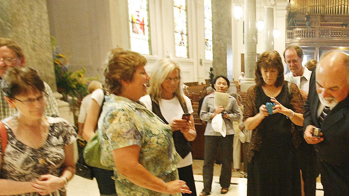 Gail Makovec touches the box with over 8,200 documents about Father Emil Kapaun for good luck following a Mass and closing ceremony for the beatification and canonization of Kapaun at the Cathedral of the Immaculate Conception on Friday. Makovec, who is from Pilsen (the same town as Kapaun) was part of the original Father Kapaun Committee. (July 1, 2011)