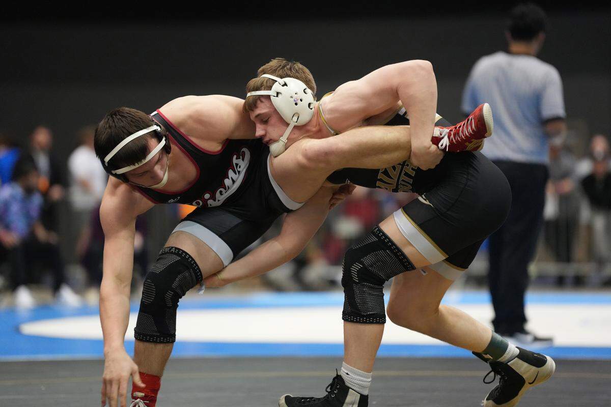 Maize South junior Joshua Kerr, right, defeated Sawyer Jorgenson of Lansing High School to win the 5A State Championship wrestling tournament.