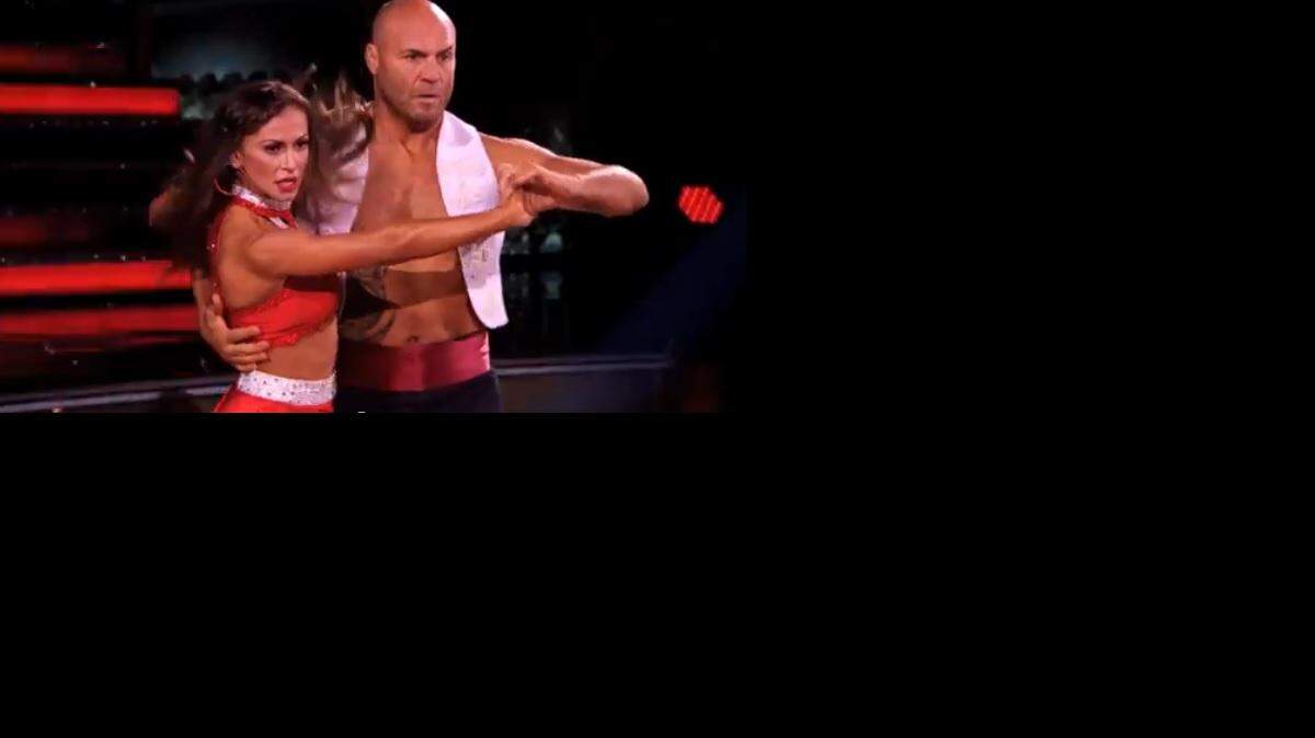 Screengrab of Randy Couture and Karina Smirnoff dancing a Paso Doble to "Eye of the Tiger" from "Rocky" on Dancing with the Stars' Movie Night.