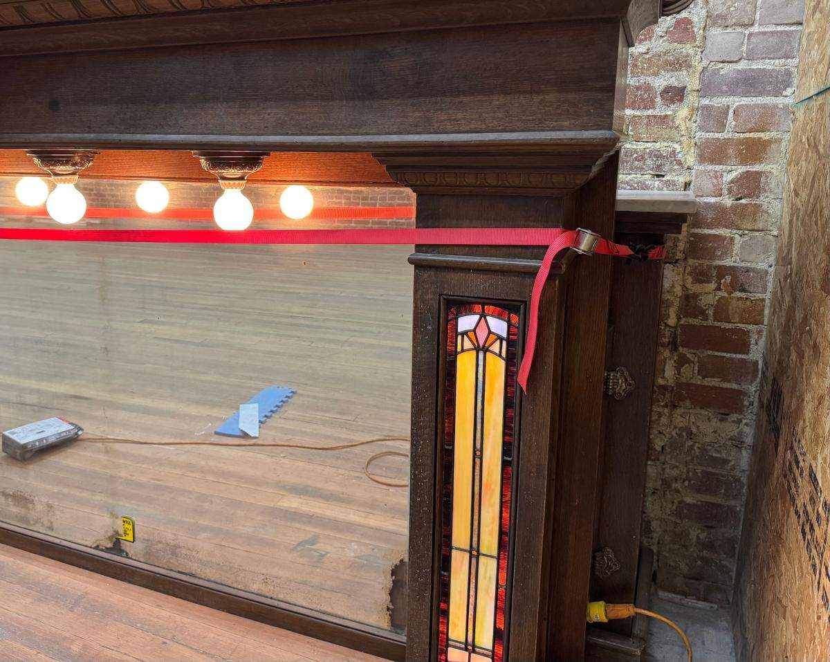 The owners of Prost purchased two antique bars from Grant Rine, whose Architectural Salvage previously occupied their space at 134 St. Francis. Pictured is a detail of the upstairs bar