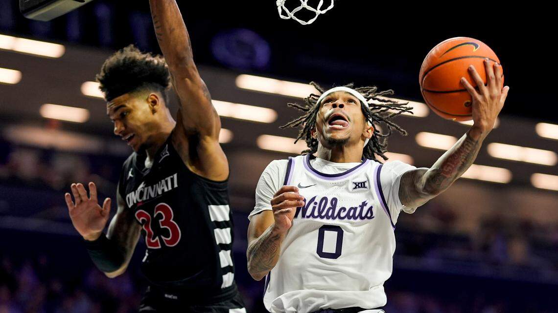 Kansas State Wildcats guard Dug McDaniel (0) shoots against Cincinnati Bearcats forward Dillon Mitchell (23) during the second half at Bramlage Coliseum on Dec. 30, 2024.