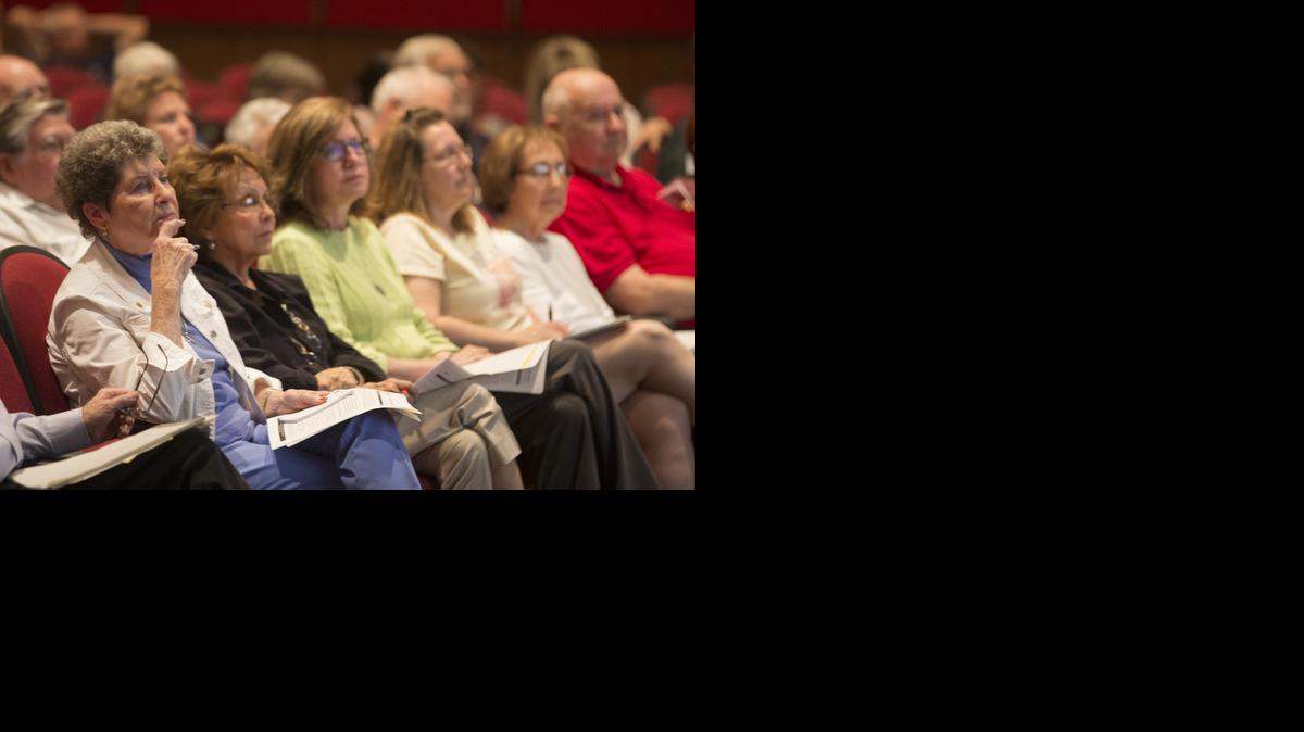 West Wichita residents listen as Bob Jurgens of the Kansas Department of Health and Environment leads a public meeting at Wilbur Middle School on Thursday evening about possible groundwater contamination. The source of the contamination is thought to be from a former dry cleaning business that operated on West Central for many years.

