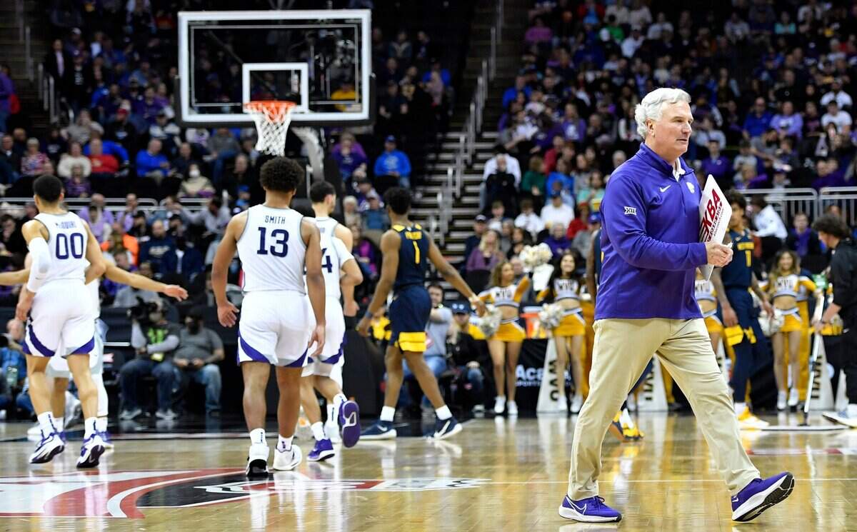 Kansas State coach Bruce Weber heads back to the bench after a timeout during the second half of the Wildcats’ 73-67 loss to West Virginia Wednesday night in the first round of the Big 12 Tournament at the T-Mobile Center in Kansas City.