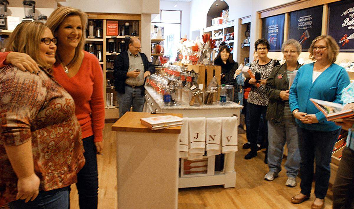 Angie Mahl has her picture taken with Trisha Yearwood in 2015 after Yearwood signed her latest cookbook at the Williams-Sonoma in Bradley Fair.