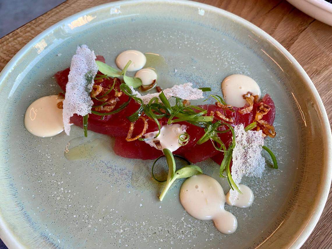 Lotte’s tuna crudo appetizer is made with raw bluefin tuna, crispy shallots and puffed rice.