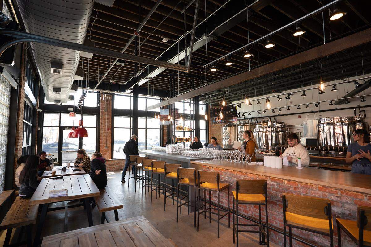 The bar at WBC Delano, which opens Wednesday at 901 W. Douglas, is lined with original bricks knocked out when the windows were installed.