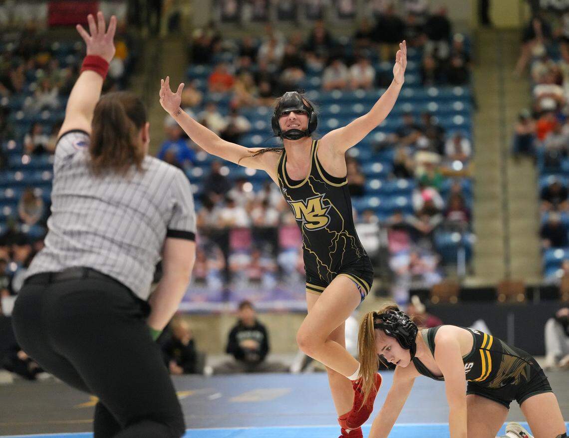 Maize South’s Krislynn Martinez reacts after winning the the 5A State Championship wrestling tournament.