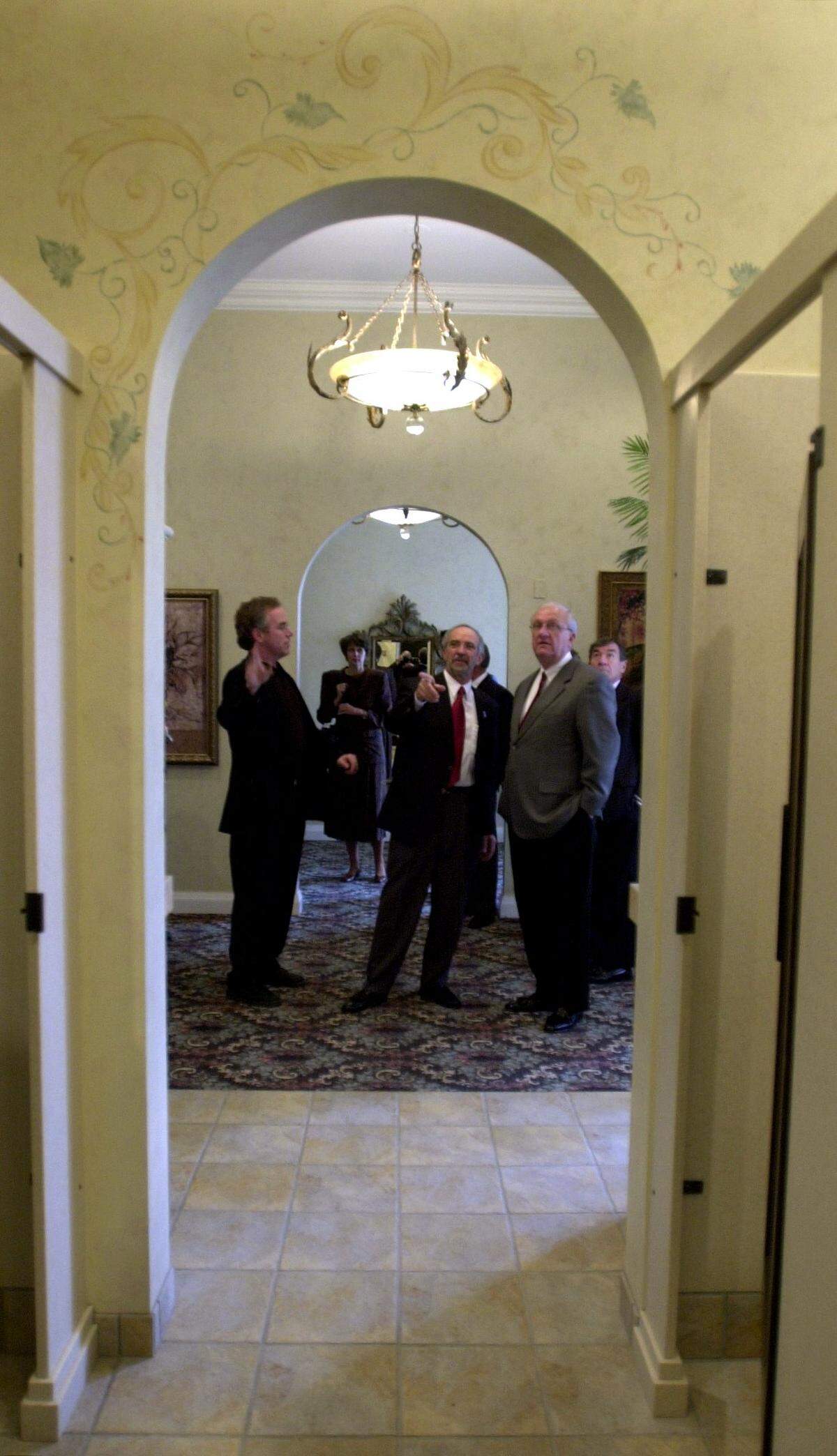 Barney Byard is pictured in 2002 giving city council members a tour of the just-restored restrooms on the second level of The Orpheum theatre.