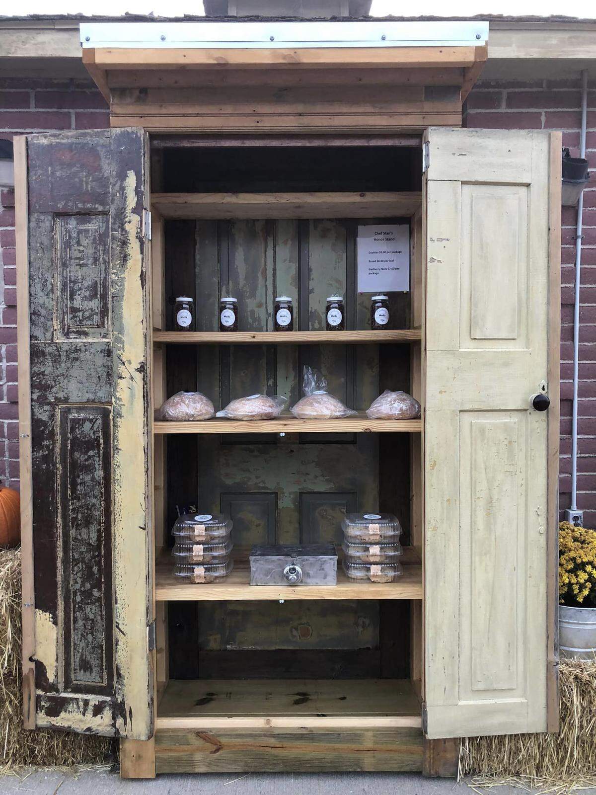 Stan Lerner made his first honor stand by re-purposing old doors. He stocks it daily with bread, cookies and toasted soybean snacks.