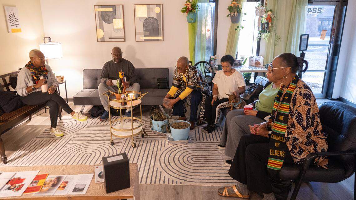 Members from the African American Council of Elders conduct a blessing inside the new location of Safe Streets, an organization that provides naloxone and emergency contraception for free, along with being a community space for people in recovery or with addiction issues.