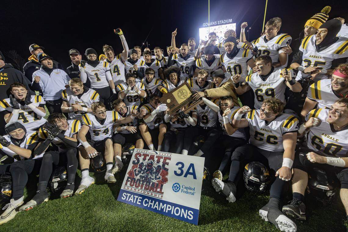 Andale celebrates their 3A state championship after beating Topeka Hayden 38-6 on Friday night in Hutchinson.