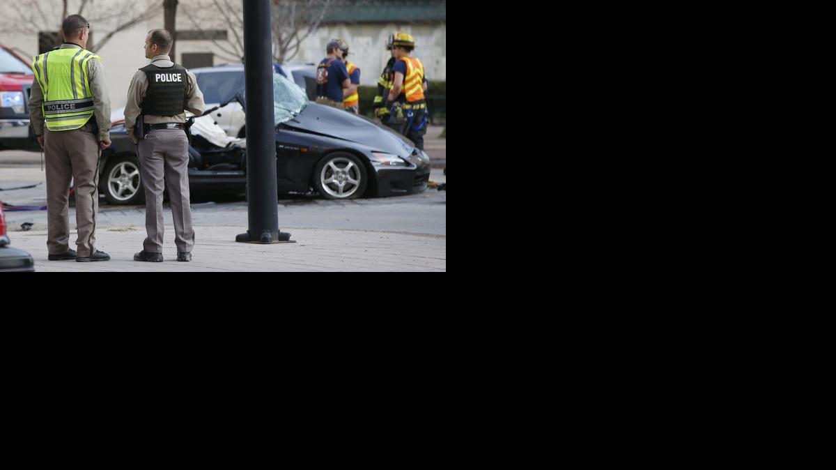 Wichita fire and police officers investigate a fatal crash at Douglas and Market on Sunday. (Jan. 12, 2014)

