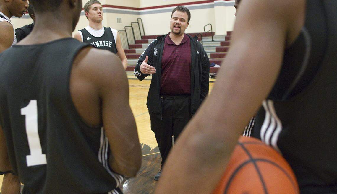 Coach Kyle Lindsted talks with his team during practice at Sunrise Christian Academy in 2012.