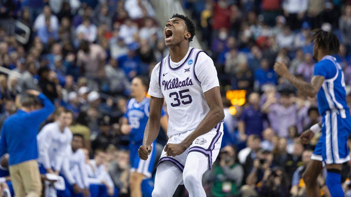 Kansas State’s Nae’Qwan Tomlin reacts after throwing down an alley-oop dunk just before halftime against Kentucky during the first half of their second round NCAA Tournament game in Greensboro, NC on Sunday.