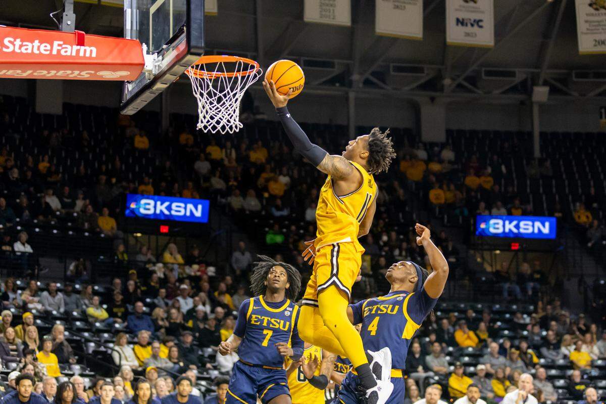 Justin Hill scores a layup for Wichita State in the first half against East Tennessee State in Saturday’s game at Koch Arena.