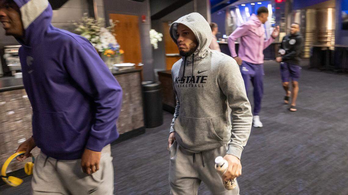 Kansas State’s Markquis Nowell (right) makes his way to an interview session at Madison Square Garden on Friday. Nowell’s play has become one of the most popular storylines of the NCAA Tournament thus far. The Wildcats will face Florida Atlantic on Saturday for a spot in the Final Four.