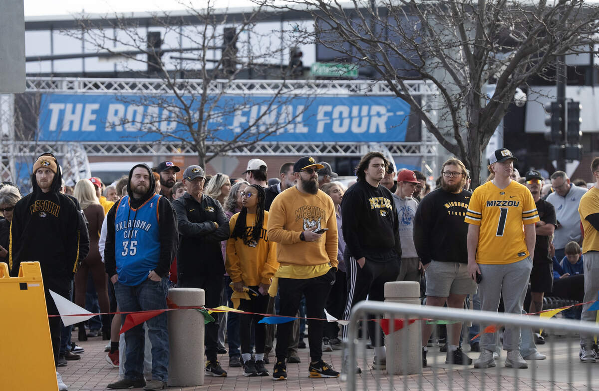 Fans line up to enter Intrust Bank Arena to watch the second set of two games in the first round of the 2025 NCAA Division I Men’s Basketball Championship.