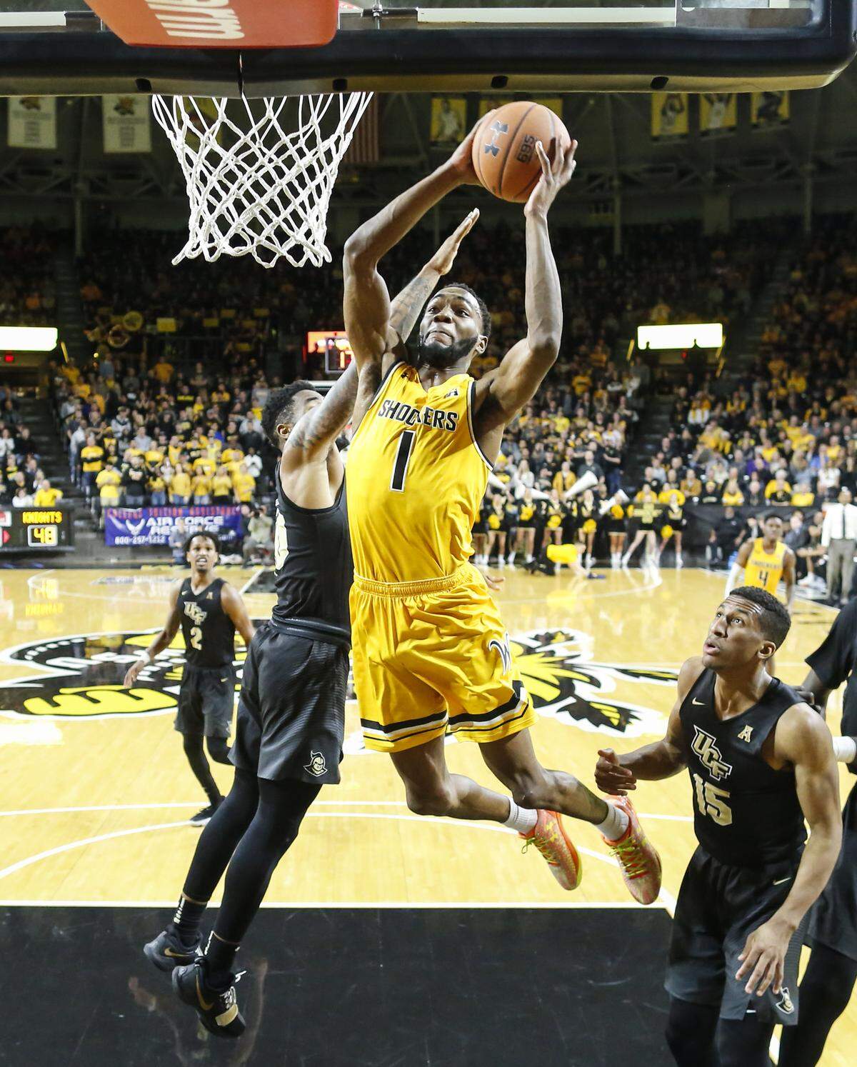 Wichita State forward Markis McDuffie goes up for a shot against UCF guard Dayon Griffin during the second half of their game at Koch Arena on Wednesday.