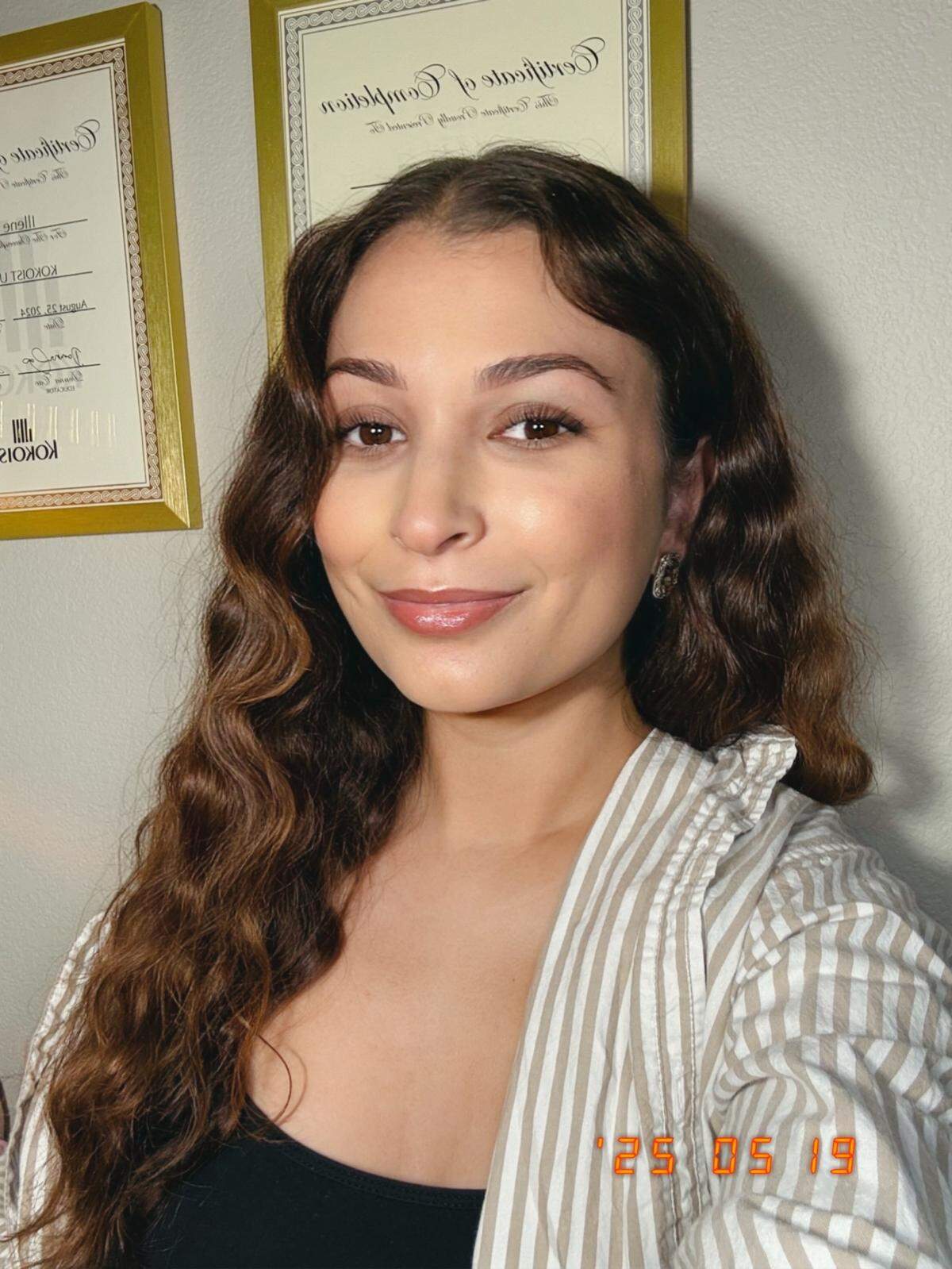 Illene Major, pictured, and her Nails by Illene are now in the same space where her grandfather, Clif Major, used to have C Major Guitars & Banjo.