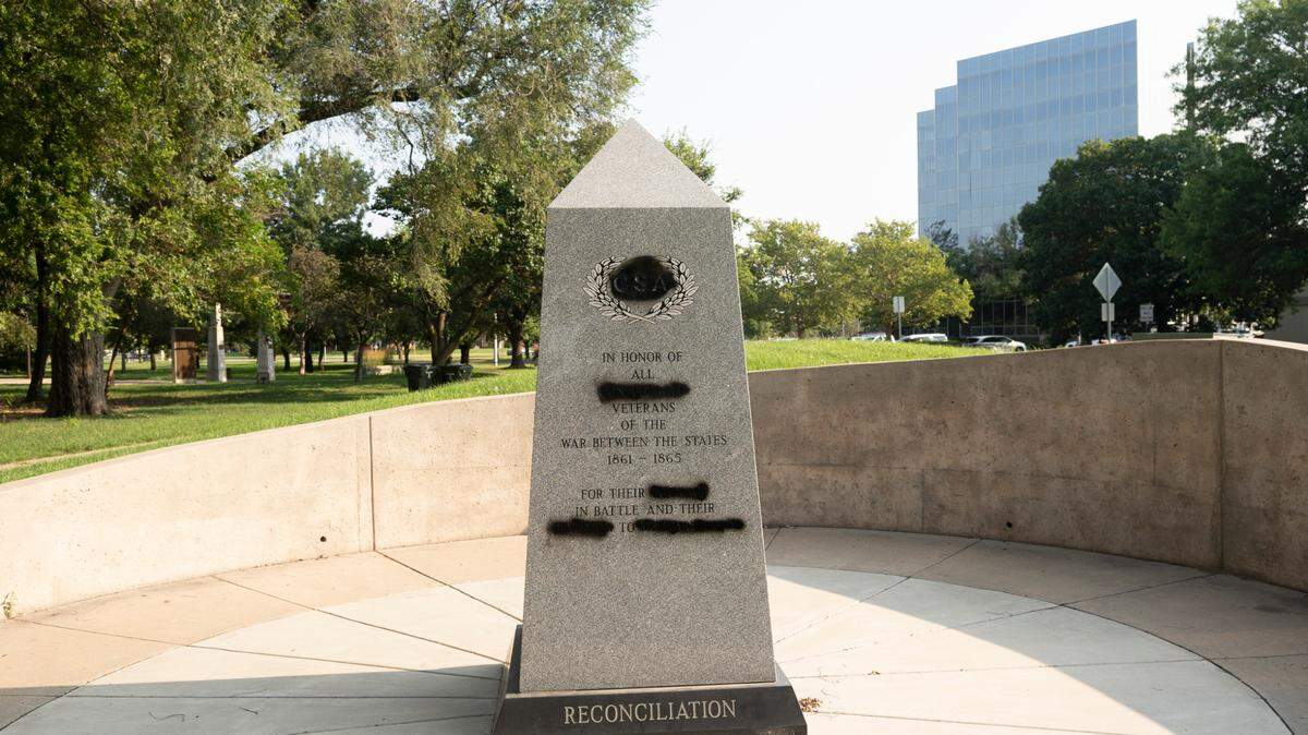 Someone took a spraypaint can to the Confederate monument at WichitaÕs Veterans Memorial Park, blacking out references to southern troopsÕ courage and sacrifice.(July 19, 2021)