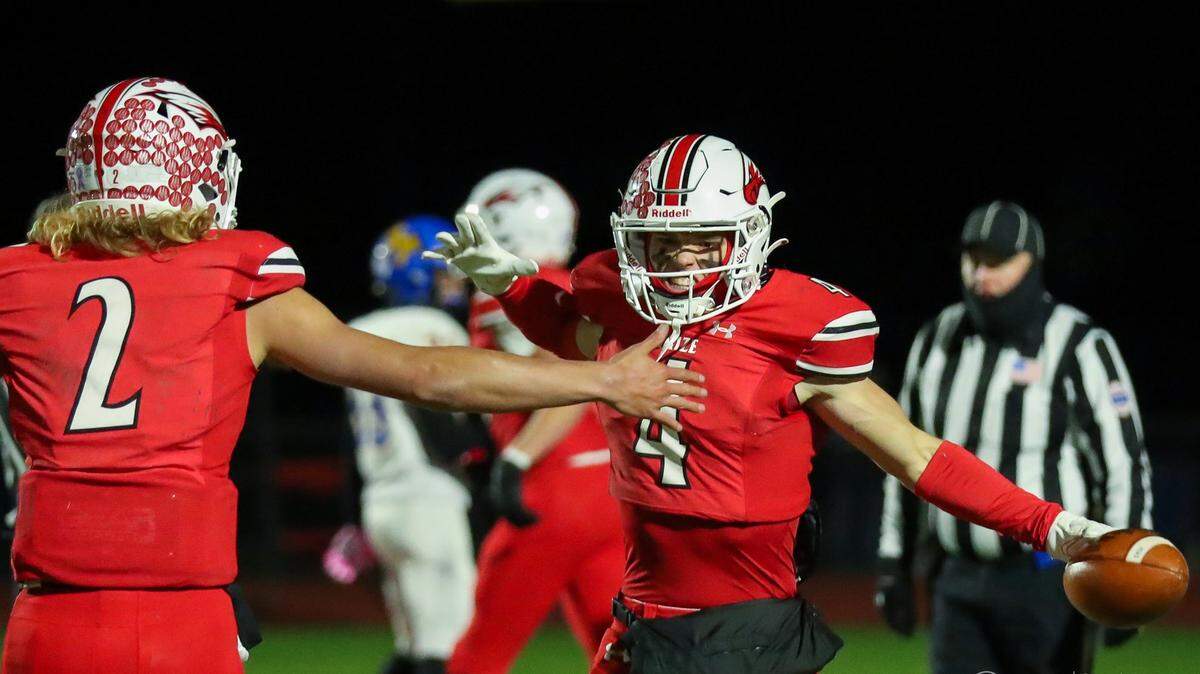 Maize wide receiver Justin Stephens celebrates a touchdown with quarterback Avery Johnson.