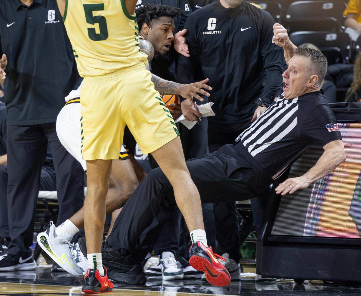 Referee Ray Natili is knocked over late in the game against Charlotte on Tuesday night at Koch Arena.