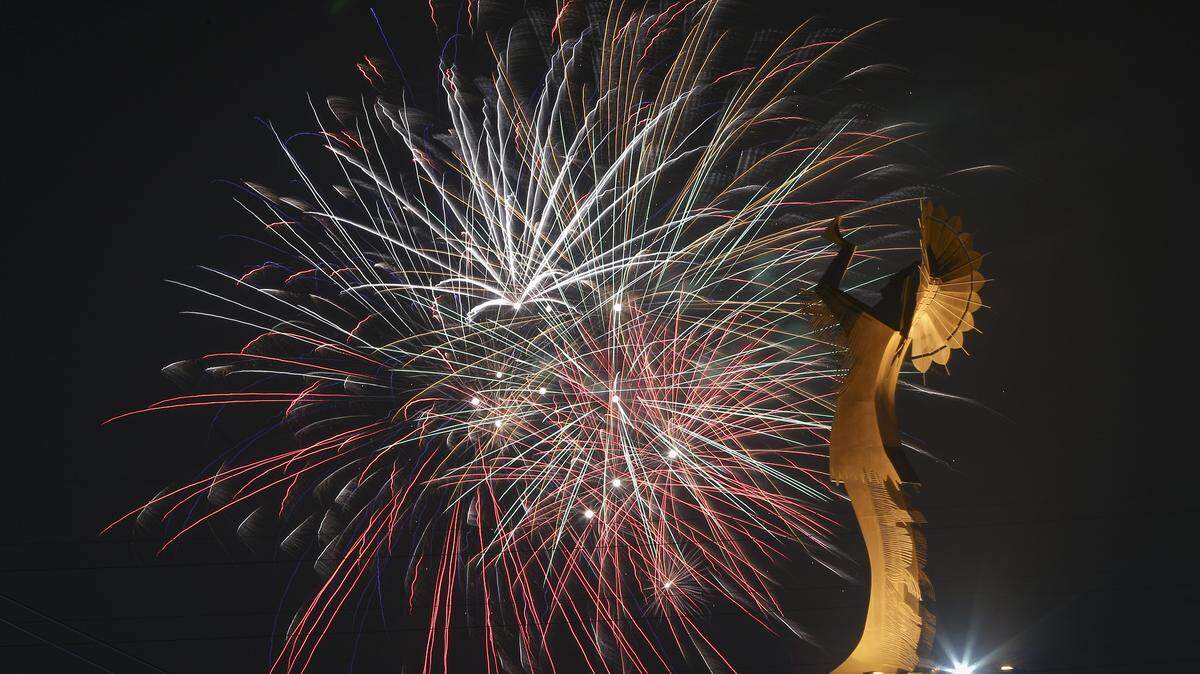 A Fourth of July fireworks display explodes behind the Keeper of the Plains statue in downtown Wichita in 2017.
