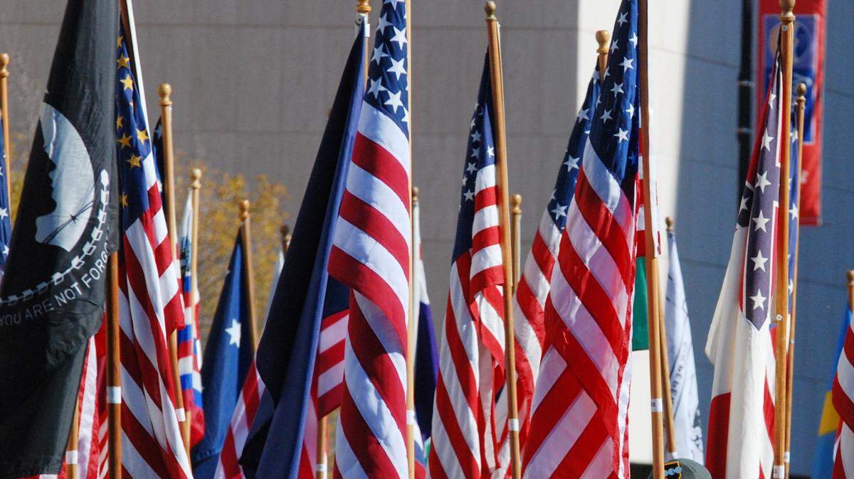 JROTC students carry flags in the Veterans Day parade in downtown Wichita in 2013. (File photo) 