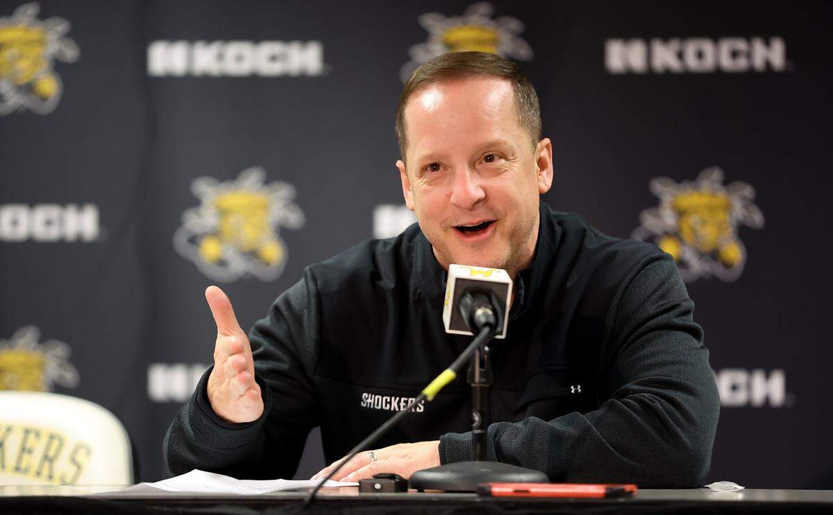 Wichita State basketball coach Paul Mills makes a point during a press conference following a win by the Shockers.