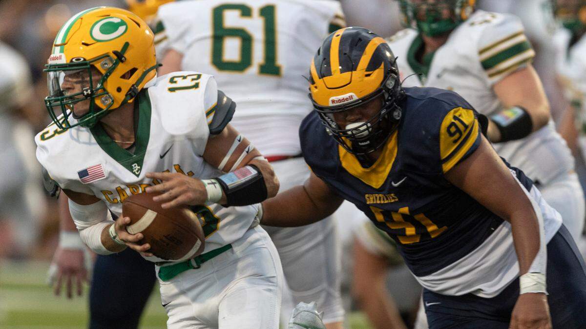 Bishop Carroll quarterback Chase Smarsh threw for multiple touchdowns in his team’s opening-week 37-27 victory over Northwest.