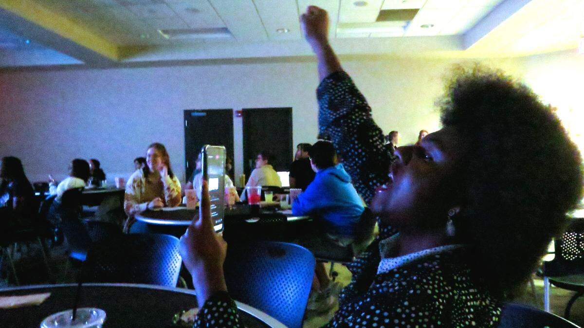 Jeshae Taylor, a Wichita State University student from Kansas City, Missouri, livestreams Tuesday’s vice presidential debate from a watch party in the student union.
