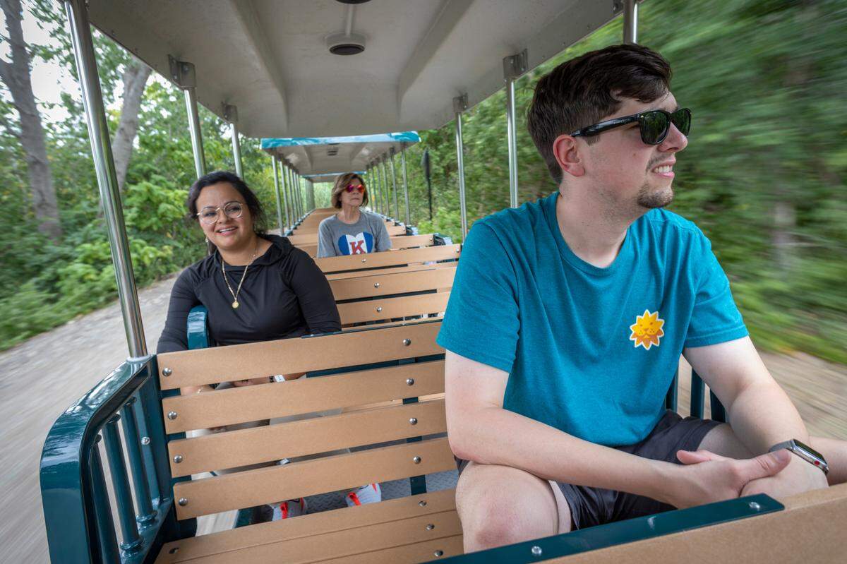 Sedgwick County Zoo employee Joey Pepoon gets a preview ride on the zoo’s new Martha C. Burford Safari Express Train on Thursday. The train opens to the public on Friday.