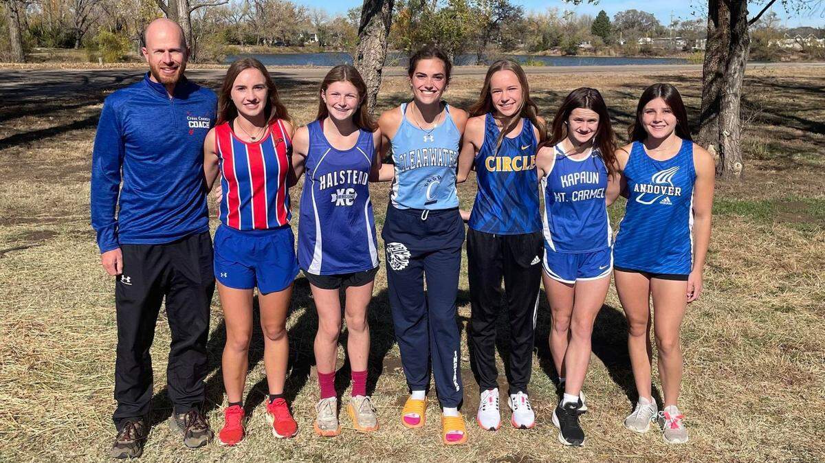 The Wichita Eagle All-Metro girls cross country team. From left to right: Cheney coach Rich Simmons, Cheney’s Abbye Hudson, Halstead’s Addisen Wills, Clearwater’s Hayley Trotter, Circle’s Brett Jacobson, Kapaun’s Taylor Barringer, Andover’s Maddy Wallace. Not pictured: Trinity’s Brecken Howell.