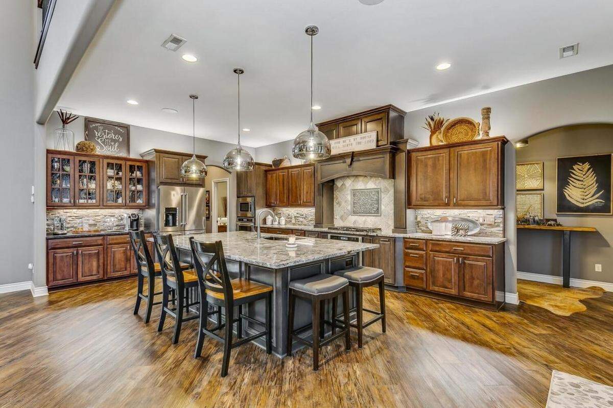 The kitchen in 7053 S. 143rd St. E. features granite countertops.
