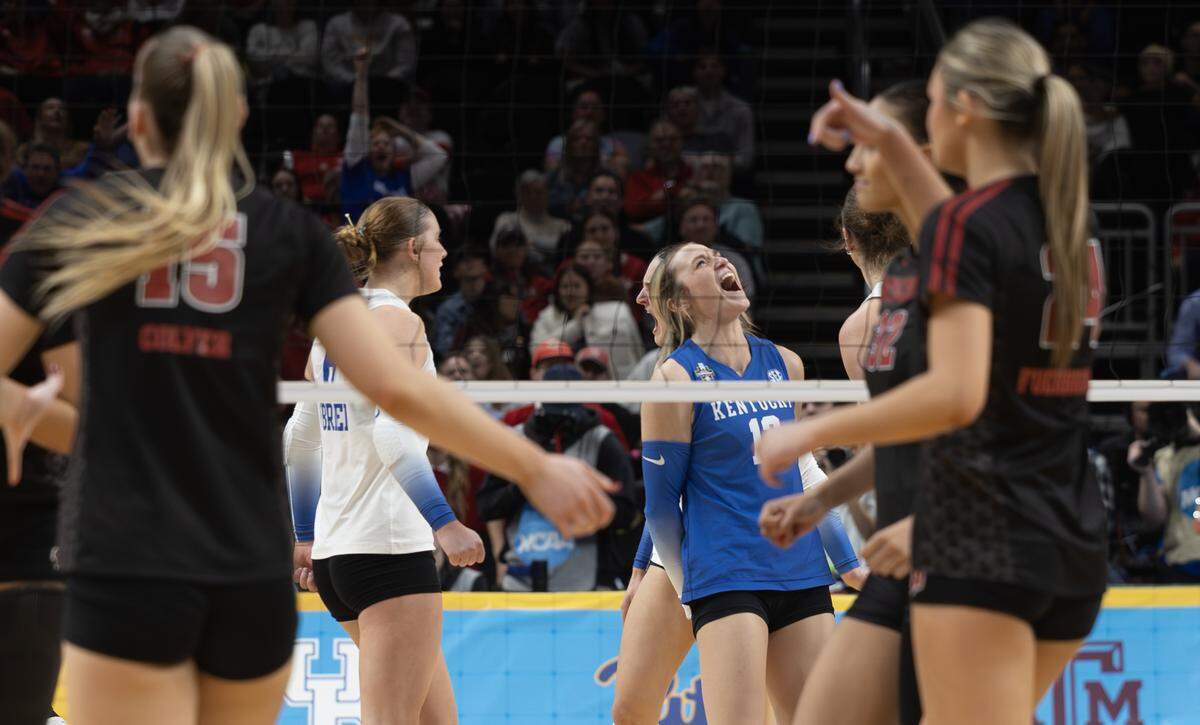 Kentucky’s Molly Tuozzo celebrates a point against Wisconsin during their semifinal match at the NCAA Volleyball Championship on Thursday night at the T-Mobile Center.