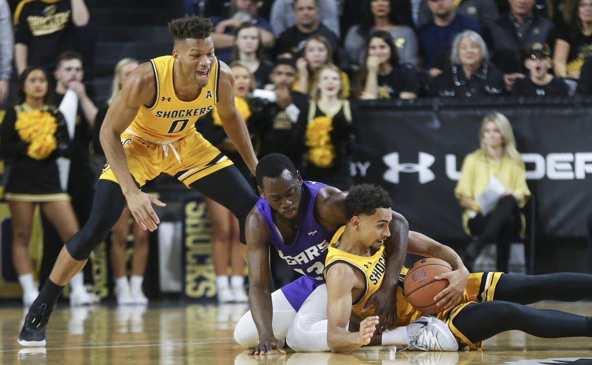 Wichita State’s Noah Fernandes gets a loose ball from Central Arkansas’ Eddy Kayouloud during the second half at Koch Arena on Thursday.