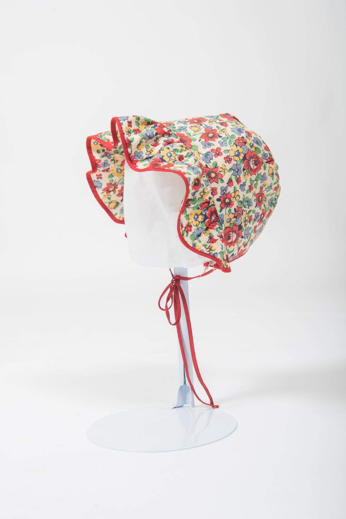 “Thrift Style,” a traveling exhibition on display until Oct. 7 at the Wichita-Sedgwick County Historical Museum, features more than 40 items from the Historic Costume and Textile Museum at Kansas State University, such as this child’s bonnet, that were donated by alum Richard D. Rees.