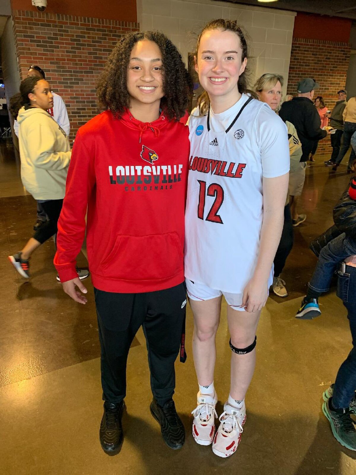 Wichita Heights senior Zyanna Walker, a Louisville signee, poses for a picture with Louisville freshman Payton Verhulst, a Bishop Miege grad. They are the last two winners of the Kansas Gatorade Player of the Year.
