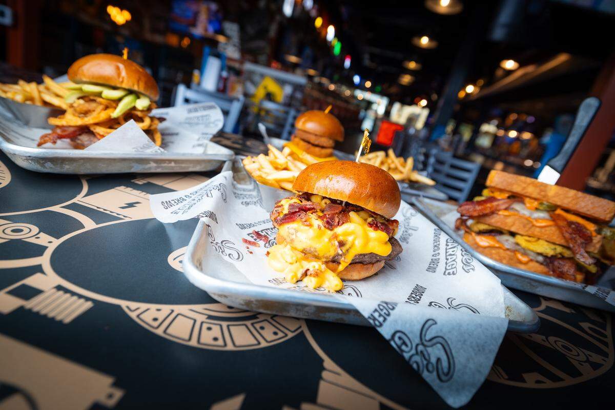 Sickies Garage is known for its menu featuring “50 Burgers, 50 Brews.”