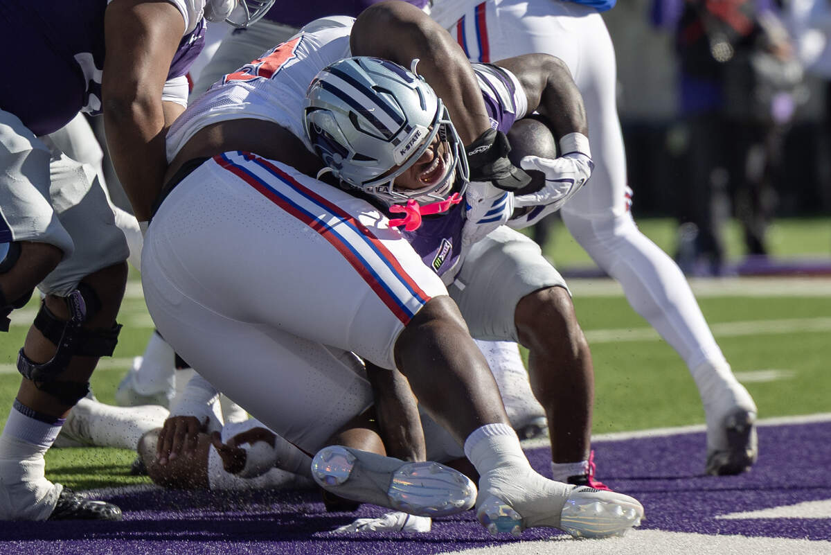 Kansas State running back Rodney Fields Jr. scores a touchdown during the first half of their game against Kansas State in Manhattan on Saturday.