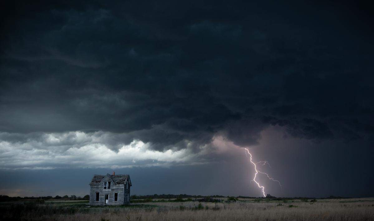 Lightning strikes near an old, abandoned farmhouse near Marquette in May of 2021.