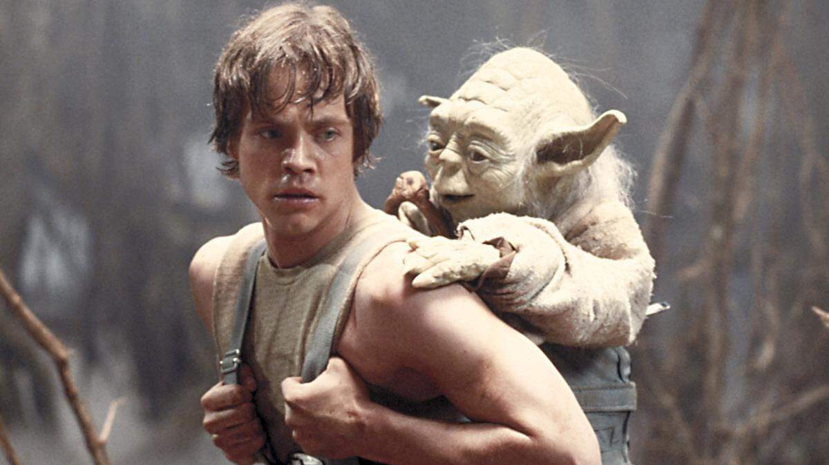 This image provided by Lucasfilm Ltd. shows Mark Hamill as Luke Skywalker and the character, Yoda, in a scene from the 1980 movie “Star Wars Episode V: The Empire Strikes Back.”