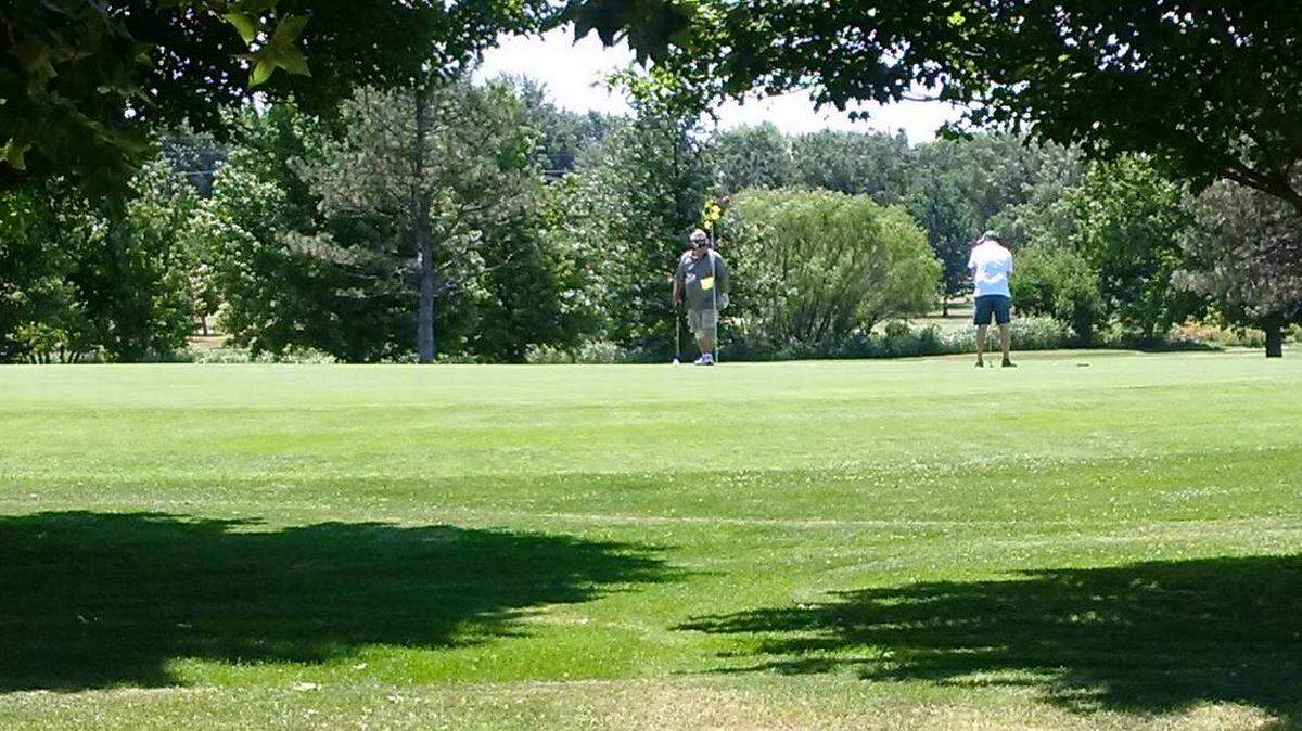 Players on the green at Clapp Golf Course.