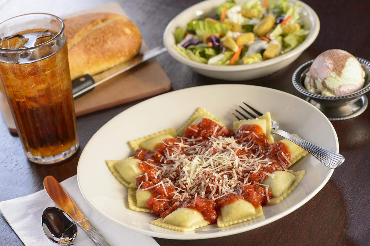 The Old Spaghetti Factory is known for its three-course meals, which come with bread, soup or salad, entree of choice and a scoop of spumoni ice cream.