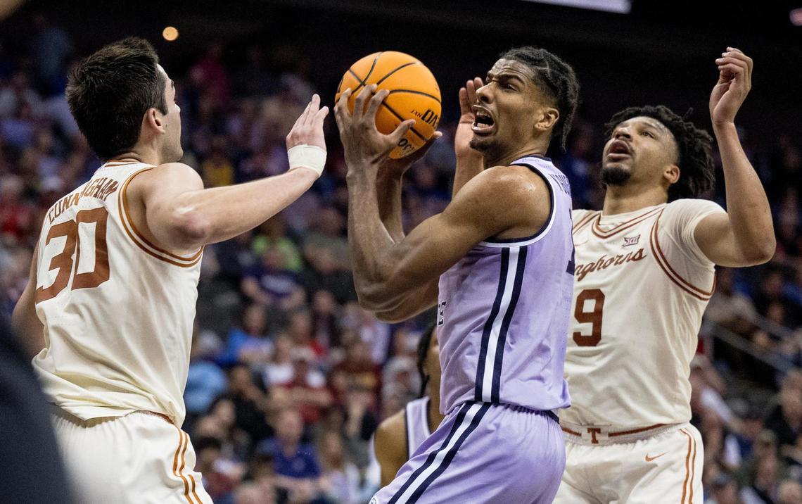 Kansas State Wildcats forward David N’Guessan (1) attempts a layup against Texas Longhorns forward Brock Cunningham (30) during the Big 12 men’s basketball tournament on Wednesday, March 13, 2024, in Kansas City.