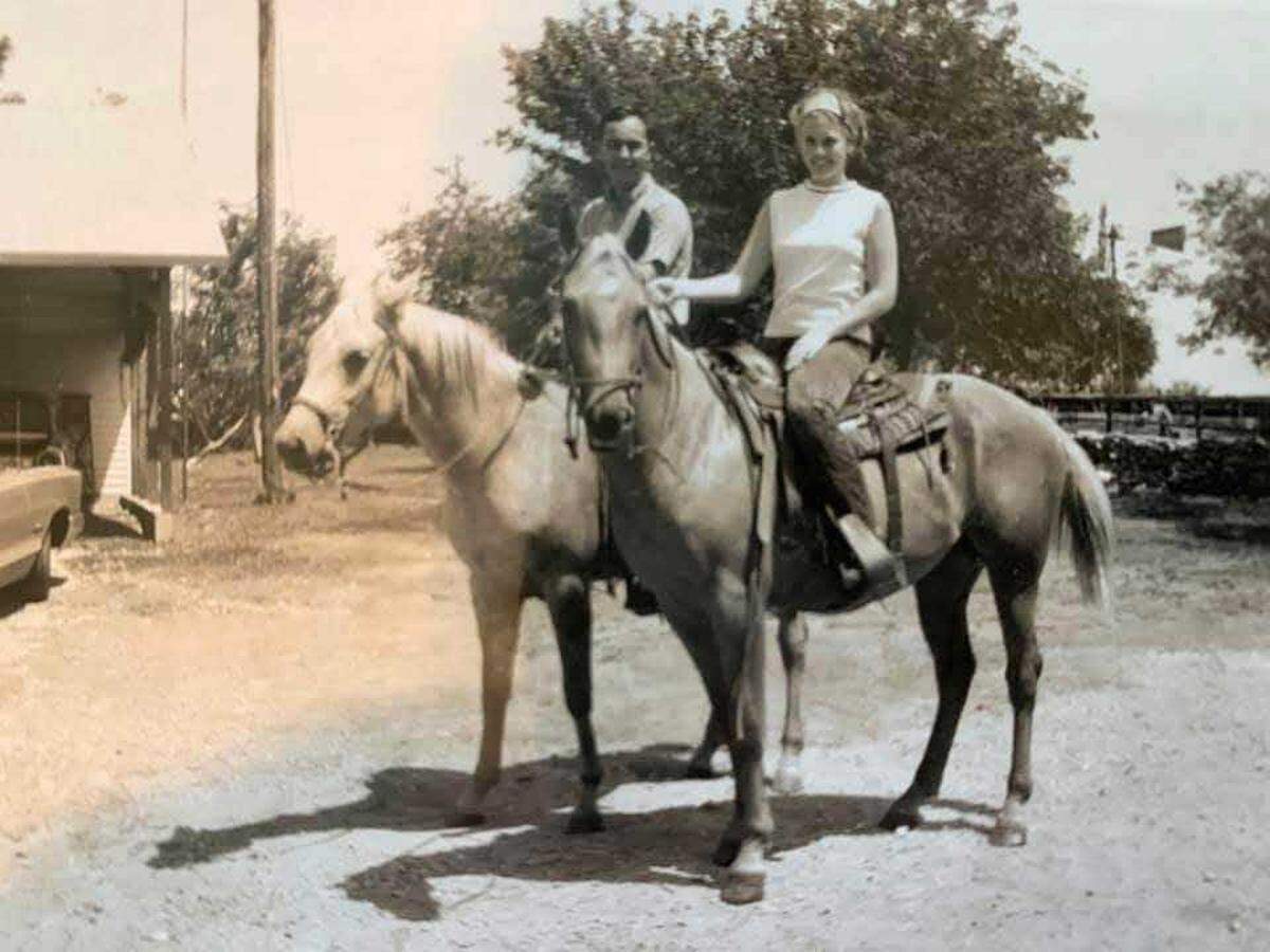 An old photo of Jim Hoy and his wife, Cathy, on horses. Jim Hoy died Feb. 23. She died in 2019.